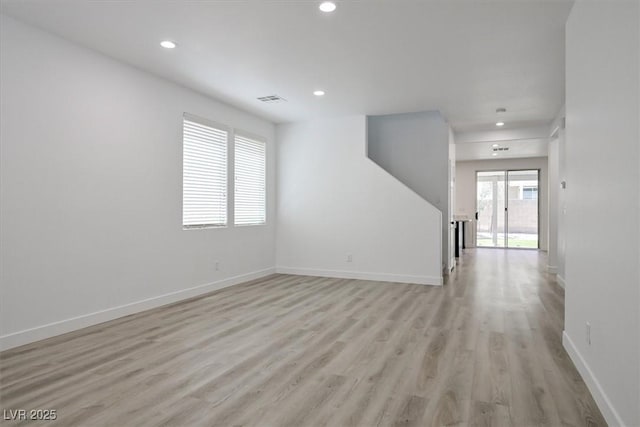 6133 Roseboro Ct, North Las Vegas, NV 89081 - unfurnished living room with light wood finished floors and recessed lighting