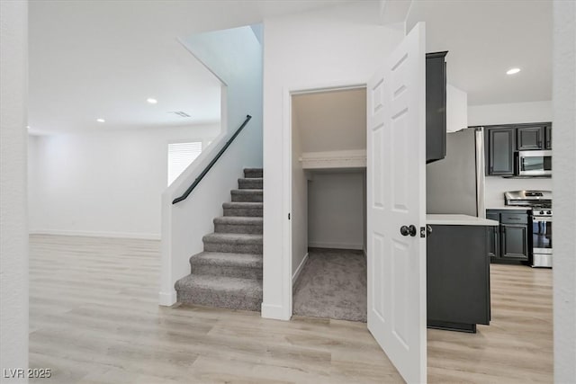 6133 Roseboro Ct, North Las Vegas, NV 89081 - stairway featuring wood finished floors and recessed lighting