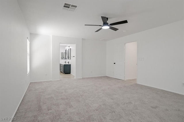 6133 Roseboro Ct, North Las Vegas, NV 89081 - spare room featuring a ceiling fan and light colored carpet