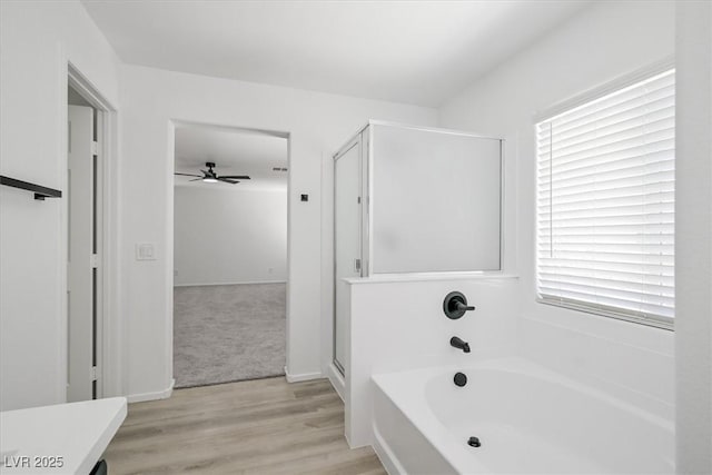 6133 Roseboro Ct, North Las Vegas, NV 89081 - full bath with a bath, a stall shower, wood finished floors, and a ceiling fan