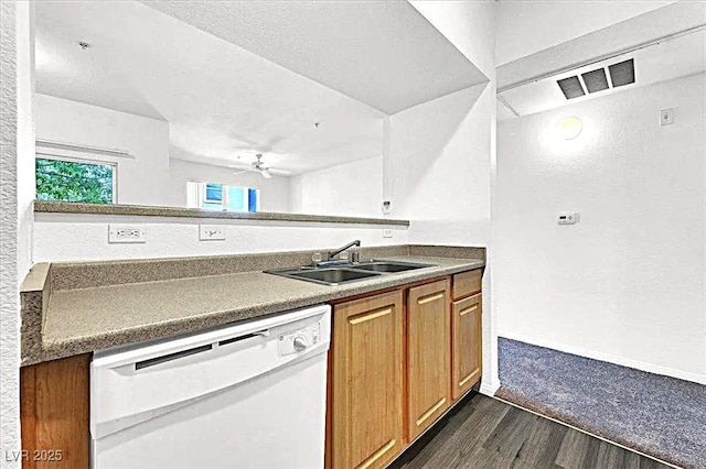 6955 N Durango Dr Unit 1022, Las Vegas, NV 89149 - kitchen with dishwasher, dark wood-style floors, brown cabinetry, ceiling fan, and a textured wall
