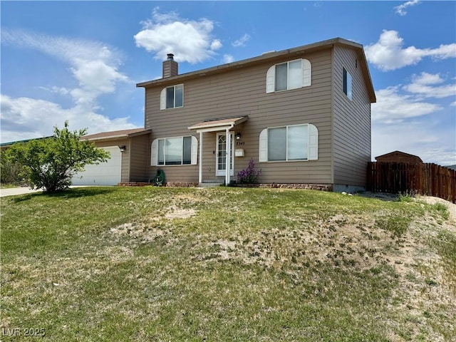 2345 Iron Dr, Ely, NV 89301 - traditional-style house featuring a chimney and an attached garage