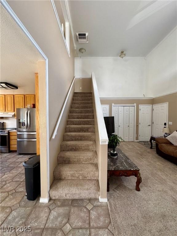2345 Iron Dr, Ely, NV 89301 - stairs featuring a towering ceiling