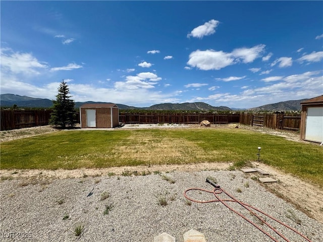 2345 Iron Dr, Ely, NV 89301 - fenced backyard featuring a shed and a mountain view
