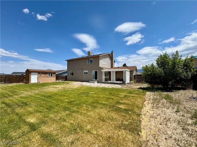 2345 Iron Dr, Ely, NV 89301 - back of house featuring a chimney, a patio area, and a shed