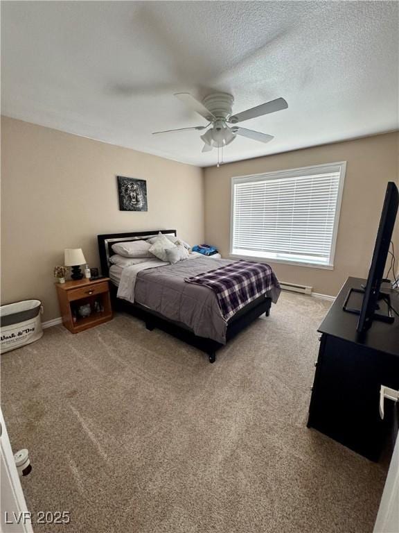 2345 Iron Dr, Ely, NV 89301 - bedroom with a baseboard radiator, carpet, ceiling fan, and a textured ceiling