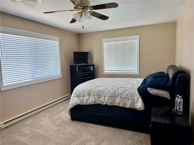 2345 Iron Dr, Ely, NV 89301 - carpeted bedroom with a baseboard radiator and a ceiling fan