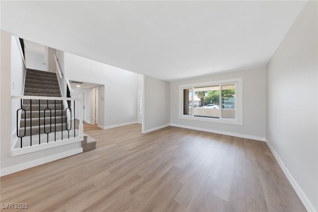 1511 Irene Dr, Boulder City, NV 89005 - unfurnished living room featuring stairs and wood finished floors