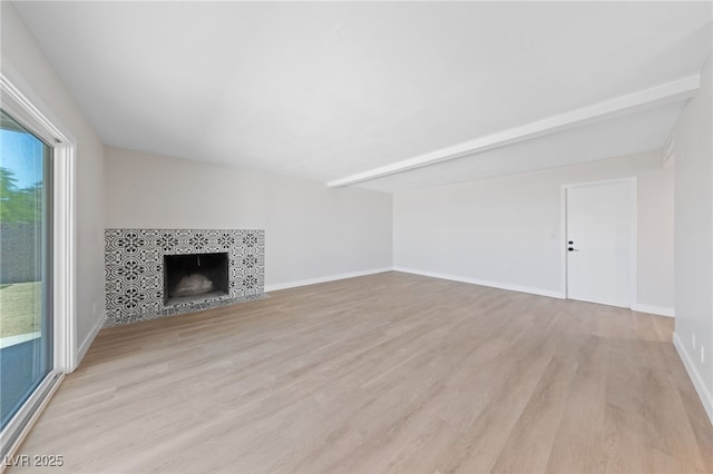 1511 Irene Dr, Boulder City, NV 89005 - unfurnished living room featuring light wood-style flooring and a tile fireplace