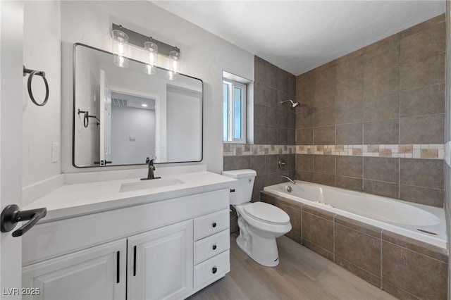 1511 Irene Dr, Boulder City, NV 89005 - full bathroom with tiled shower / bath combo, vanity, and wood finished floors