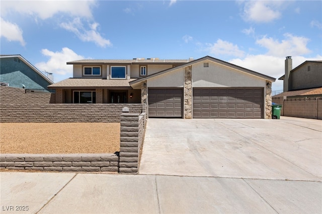 1511 Irene Dr, Boulder City, NV 89005 - view of front of house with driveway, a garage, and stucco siding