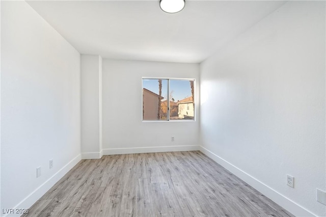 9541 Summersweet Ct, Las Vegas, NV 89123 - unfurnished room featuring wood finished floors and baseboards