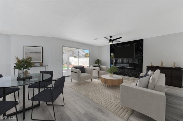 9541 Summersweet Ct, Las Vegas, NV 89123 - living area featuring a ceiling fan, wood finished floors, and a high end fireplace