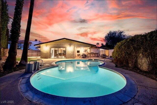3597 Cochise Ln, Las Vegas, NV 89169 - view of swimming pool with a patio area and a fenced backyard