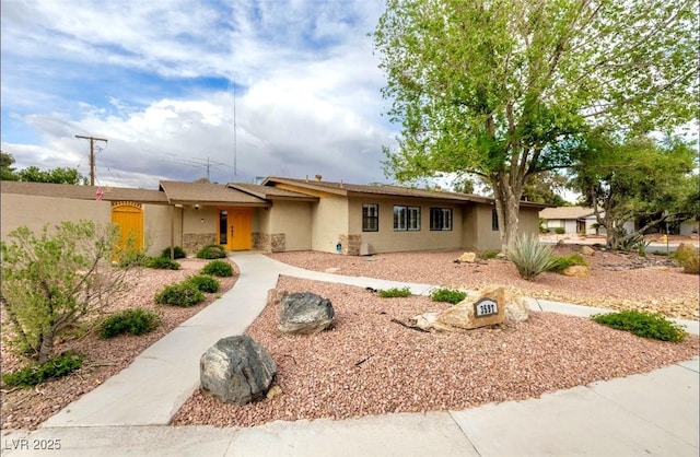 3597 Cochise Ln, Las Vegas, NV 89169 - view of front of home with stucco siding and stone siding