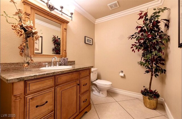 3597 Cochise Ln, Las Vegas, NV 89169 - half bathroom featuring vanity, ornamental molding, and tile patterned floors
