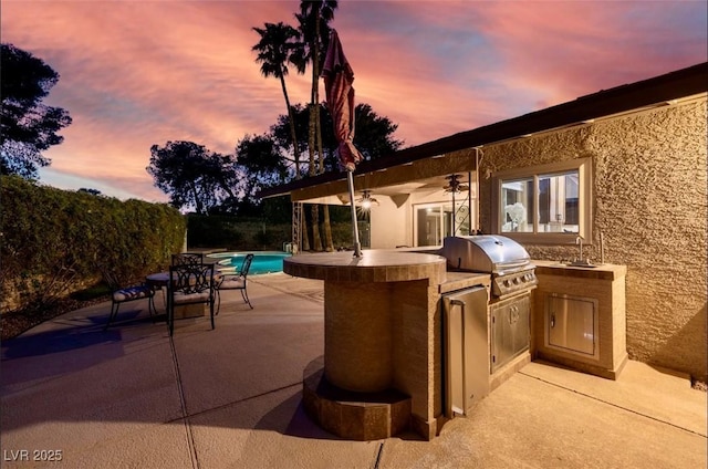 3597 Cochise Ln, Las Vegas, NV 89169 - view of patio with exterior kitchen and a sink