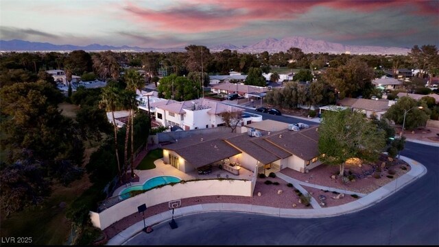3597 Cochise Ln, Las Vegas, NV 89169 - aerial view of property and surrounding area with a mountainous background and nearby suburban area