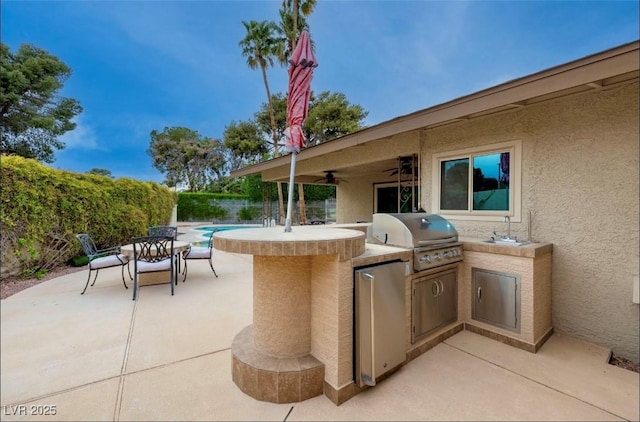 3597 Cochise Ln, Las Vegas, NV 89169 - view of patio / terrace with exterior kitchen and ceiling fan