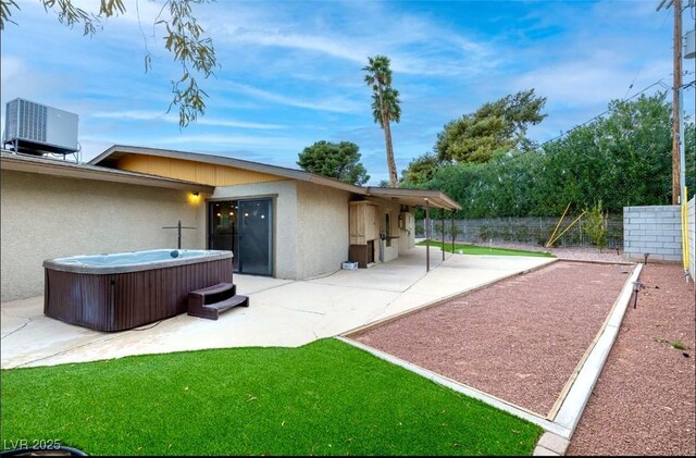 3597 Cochise Ln, Las Vegas, NV 89169 - view of yard featuring a hot tub and a patio