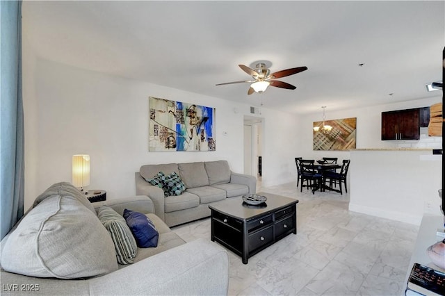 4200 S Valley View Blvd Unit 2009, Las Vegas, NV 89103 - living room with ceiling fan, light marble finish flooring, and a chandelier