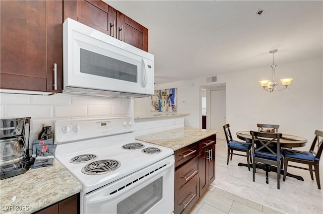 4200 S Valley View Blvd Unit 2009, Las Vegas, NV 89103 - kitchen with white appliances, a chandelier, decorative light fixtures, and light stone counters