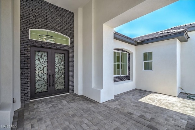 1525 Heights Dr, Logandale, NV 89021 - property entrance with french doors and stucco siding