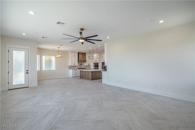 1525 Heights Dr, Logandale, NV 89021 - unfurnished living room with ceiling fan and recessed lighting