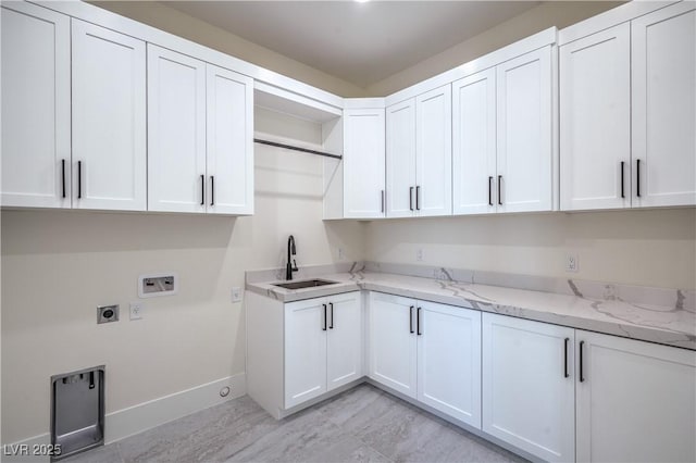 1525 Heights Dr, Logandale, NV 89021 - washroom with hookup for a washing machine, cabinet space, and electric dryer hookup