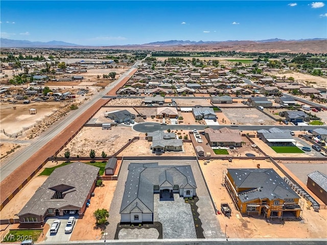 1525 Heights Dr, Logandale, NV 89021 - aerial view of residential area with a mountain backdrop