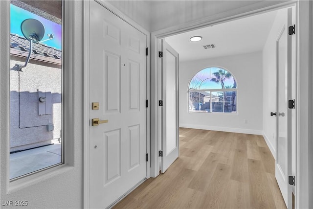 10200 Wood Work Ln, Las Vegas, NV 89135 - entryway featuring light wood-type flooring and baseboards
