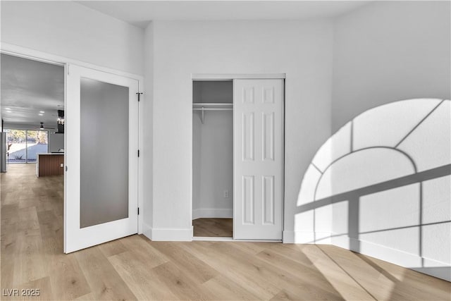 10200 Wood Work Ln, Las Vegas, NV 89135 - unfurnished bedroom with wood finished floors and a closet