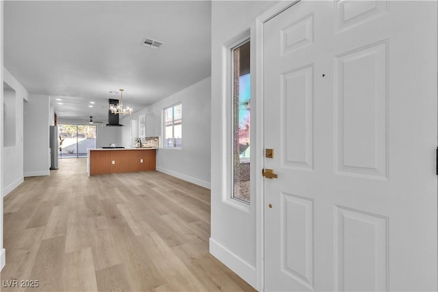 10200 Wood Work Ln, Las Vegas, NV 89135 - foyer with a chandelier and light wood-style floors