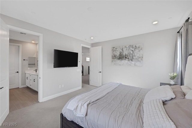12426 Alpenglow Ct, Las Vegas, NV 89138 - bedroom featuring light colored carpet, recessed lighting, and ensuite bath