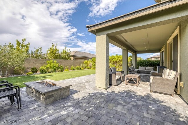 12426 Alpenglow Ct, Las Vegas, NV 89138 - fenced backyard featuring an outdoor living space with a fire pit and a patio area