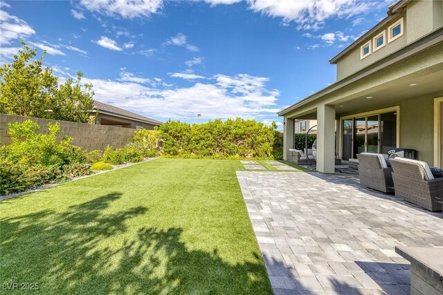 12426 Alpenglow Ct, Las Vegas, NV 89138 - view of yard featuring a patio area and an outdoor hangout area