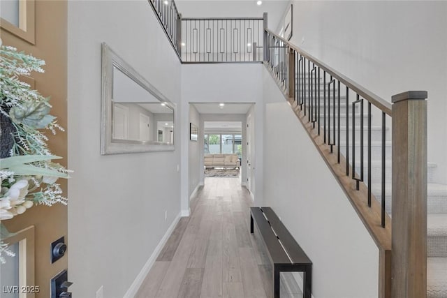 12426 Alpenglow Ct, Las Vegas, NV 89138 - corridor with wood finished floors, stairs, and a high ceiling