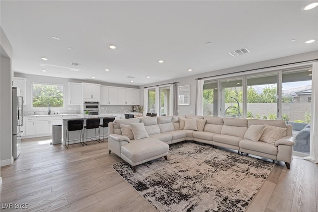 12426 Alpenglow Ct, Las Vegas, NV 89138 - living room with light wood-style floors and recessed lighting