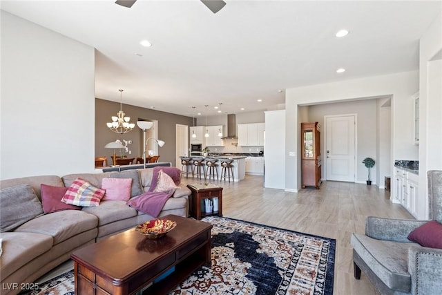 4317 Velvet Ridge Ct, Las Vegas, NV 89129 - living room featuring ceiling fan, a chandelier, recessed lighting, and light wood-type flooring