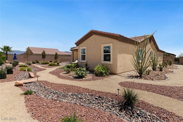 4317 Velvet Ridge Ct, Las Vegas, NV 89129 - view of side of home featuring stucco siding