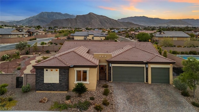4317 Velvet Ridge Ct, Las Vegas, NV 89129 - view of front of house with a tile roof, a garage, a mountain view, and a residential view