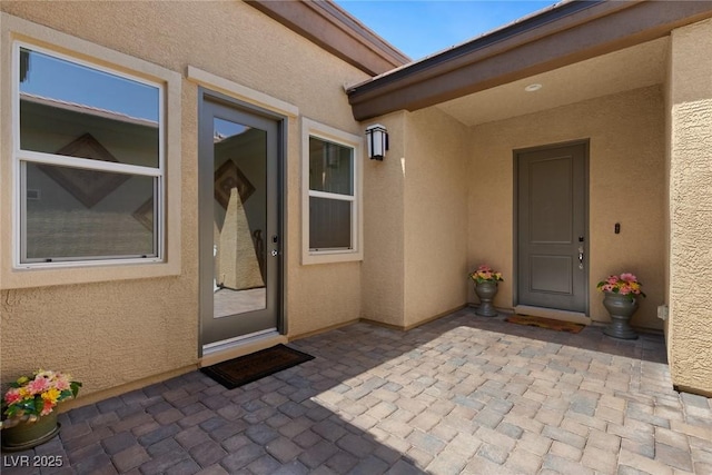 4317 Velvet Ridge Ct, Las Vegas, NV 89129 - view of exterior entry featuring stucco siding and a patio area