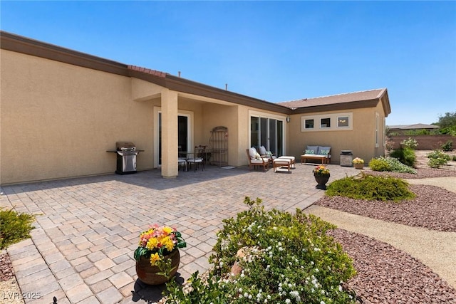 4317 Velvet Ridge Ct, Las Vegas, NV 89129 - back of house with outdoor lounge area, stucco siding, and a patio area
