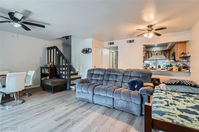 4259 Kona Coast Way, Las Vegas, NV 89121 - living area with ceiling fan, light wood-type flooring, and stairs