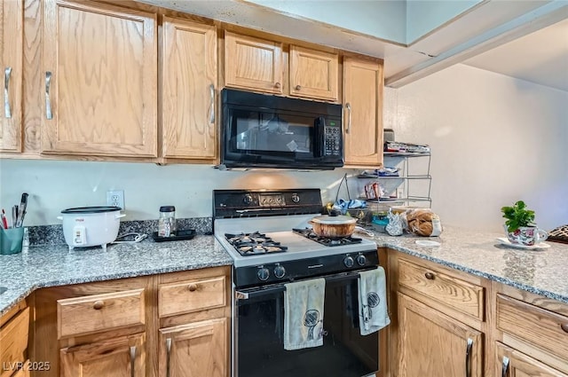 4259 Kona Coast Way, Las Vegas, NV 89121 - kitchen with black microwave, range with gas cooktop, light stone counters, and light brown cabinetry