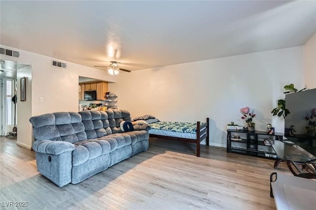 4259 Kona Coast Way, Las Vegas, NV 89121 - living area featuring wood finished floors and ceiling fan