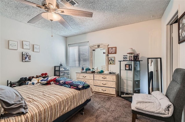 4259 Kona Coast Way, Las Vegas, NV 89121 - bedroom with dark colored carpet, a textured ceiling, and a ceiling fan
