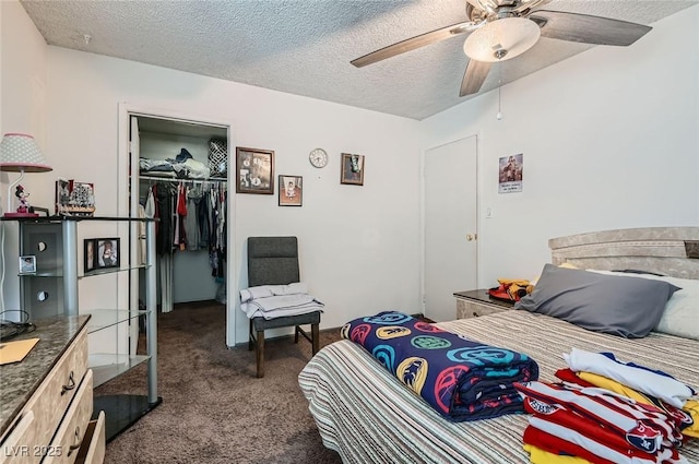 4259 Kona Coast Way, Las Vegas, NV 89121 - bedroom with dark carpet, a closet, a walk in closet, a textured ceiling, and a ceiling fan