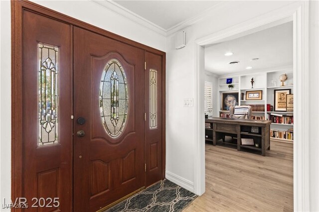 3108 Sonia Dr, Las Vegas, NV 89107 - foyer entrance featuring crown molding and light wood-style floors