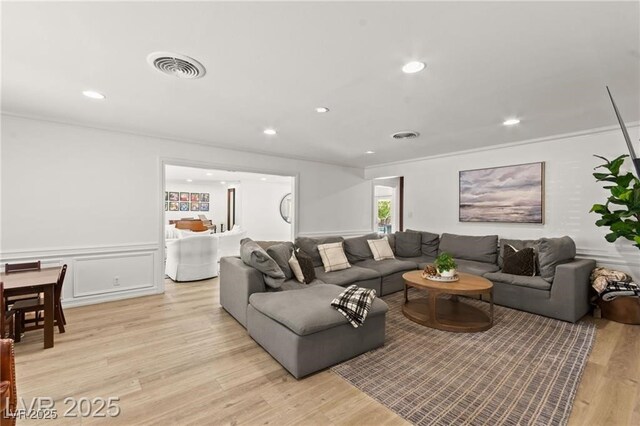 3108 Sonia Dr, Las Vegas, NV 89107 - living area with light wood-style floors, wainscoting, recessed lighting, crown molding, and a decorative wall